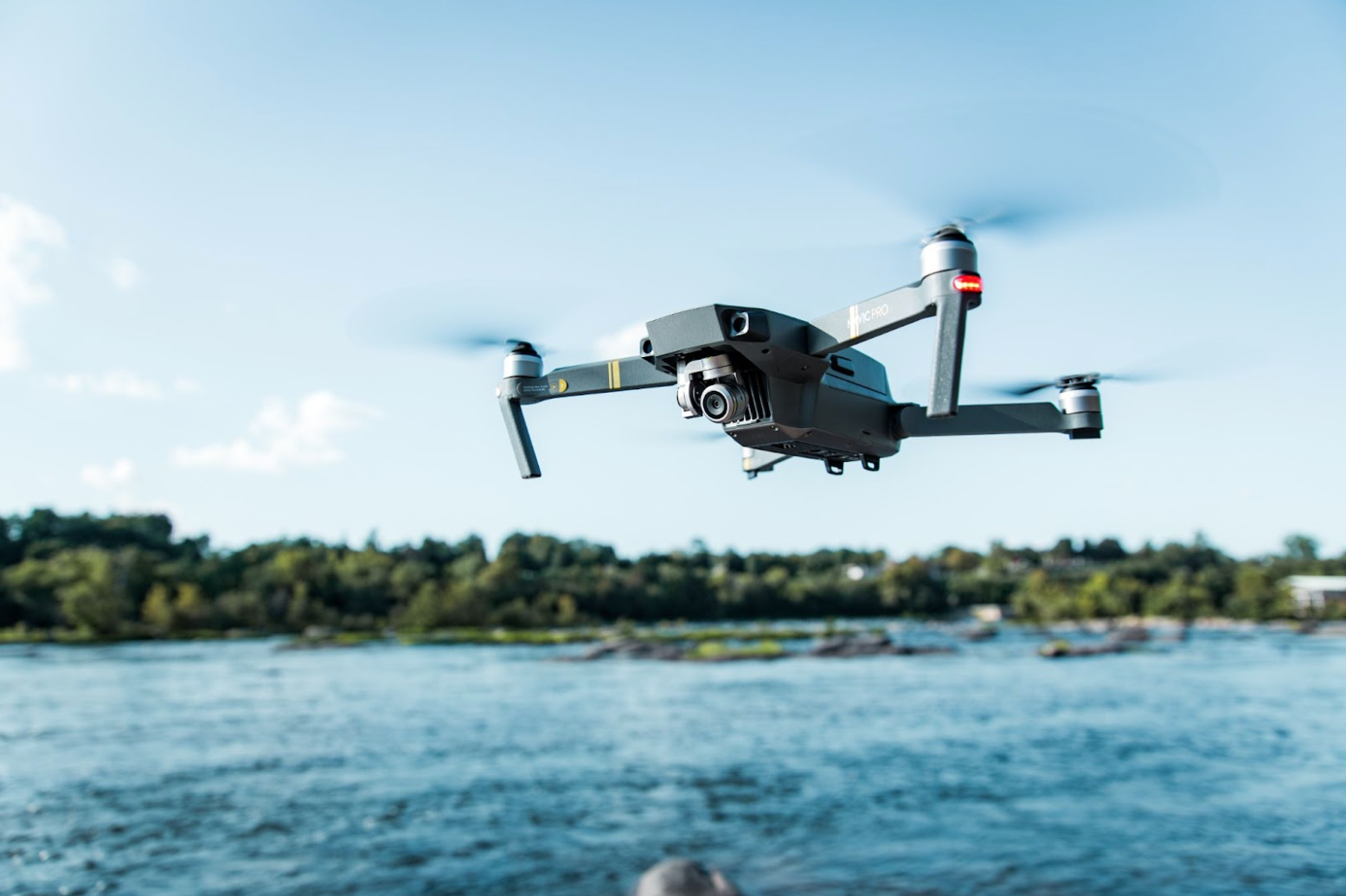 Drone technology flying over a lake