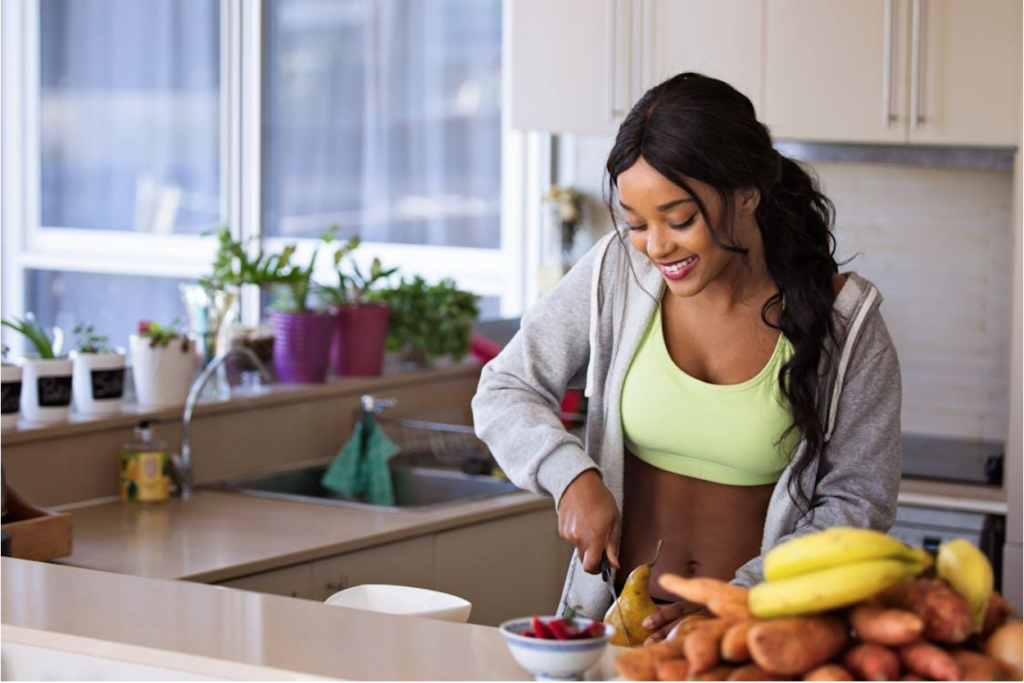 Woman prepares healthy meal in kitchen